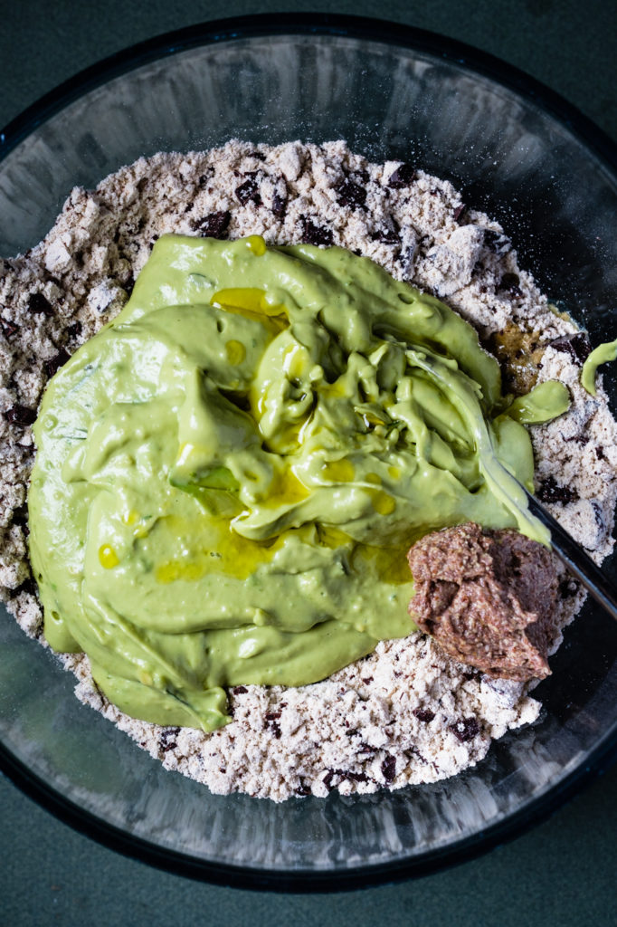 The blended mixture has been added to the dry ingredients in the mixing bowl.