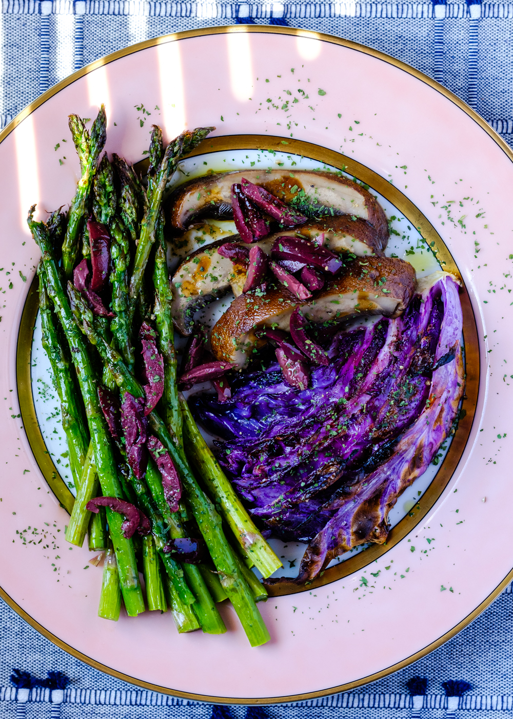 Mushroom and cabbage steak with asparagus on a plate