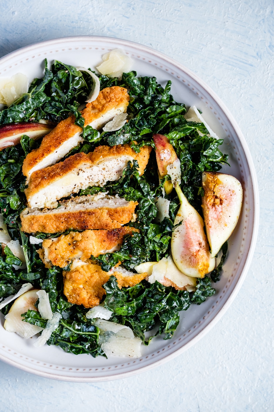 Gluten free chicken schnitzel mixed with salad