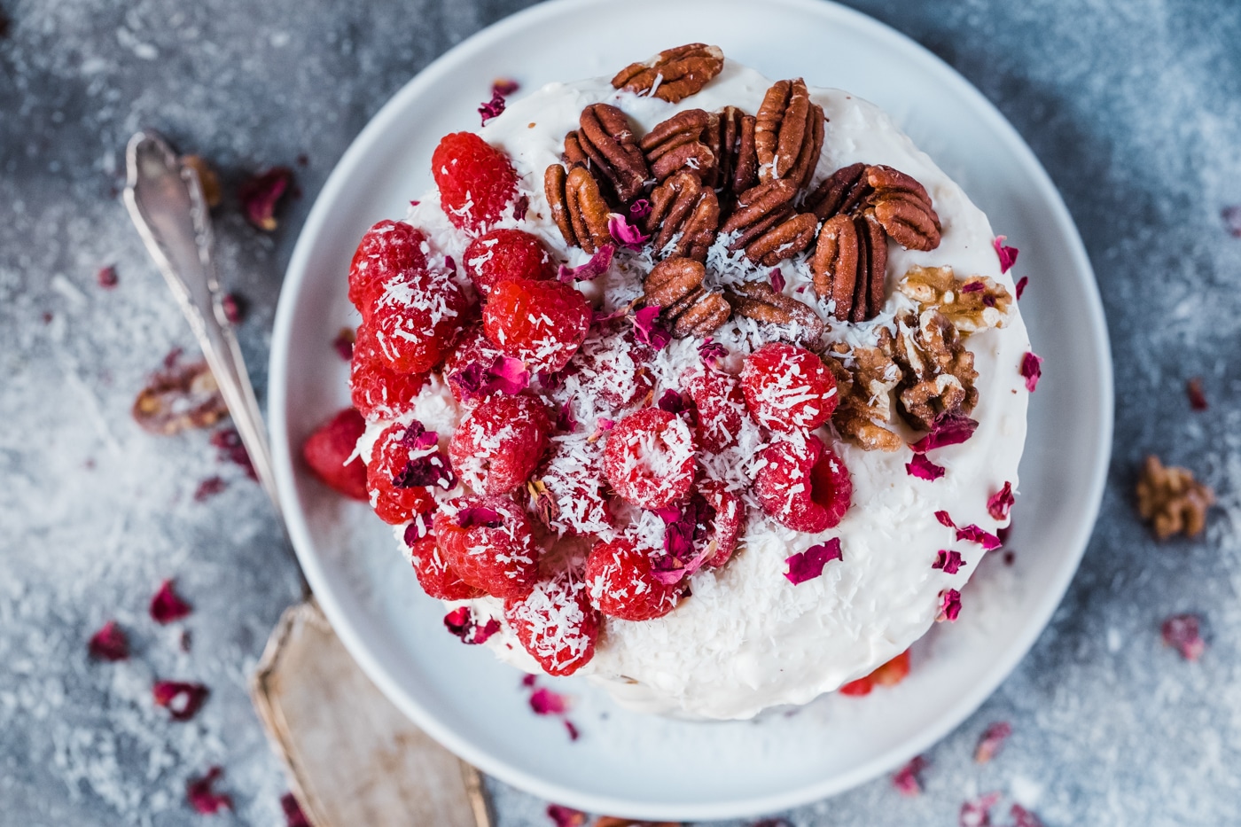 The happy birthday carrot cake with berries and nuts looks beautiful