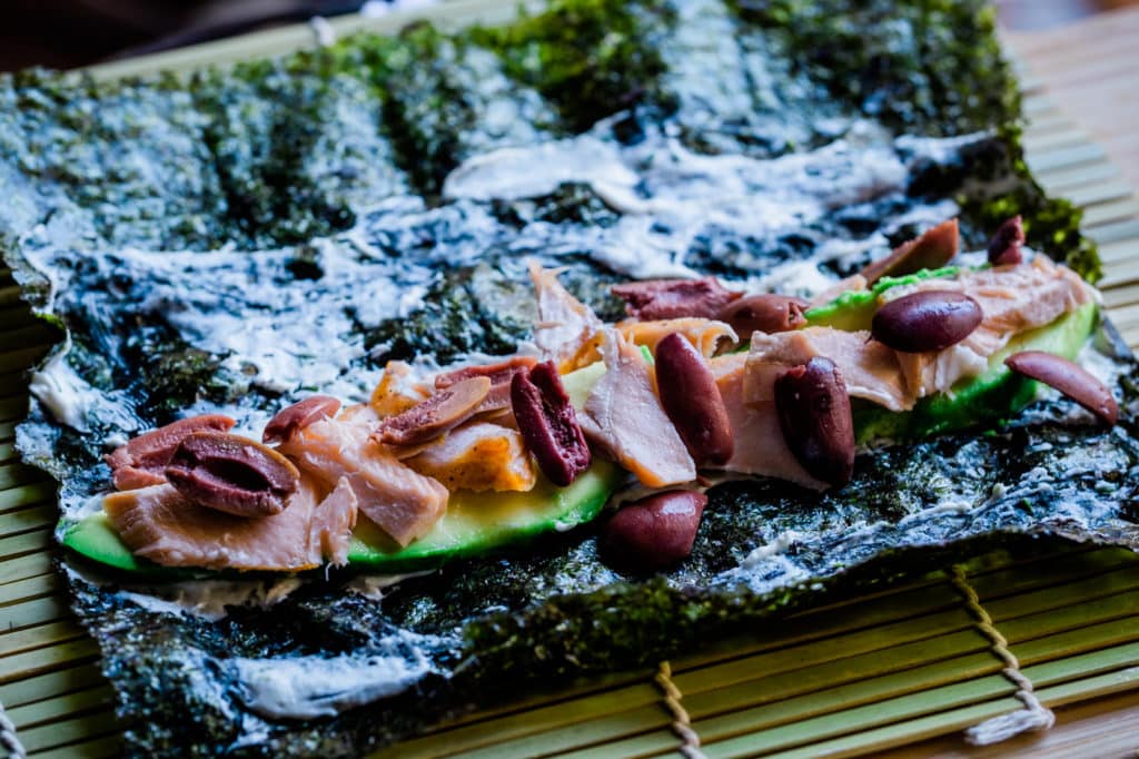 Salmon on a sushi rolling mat