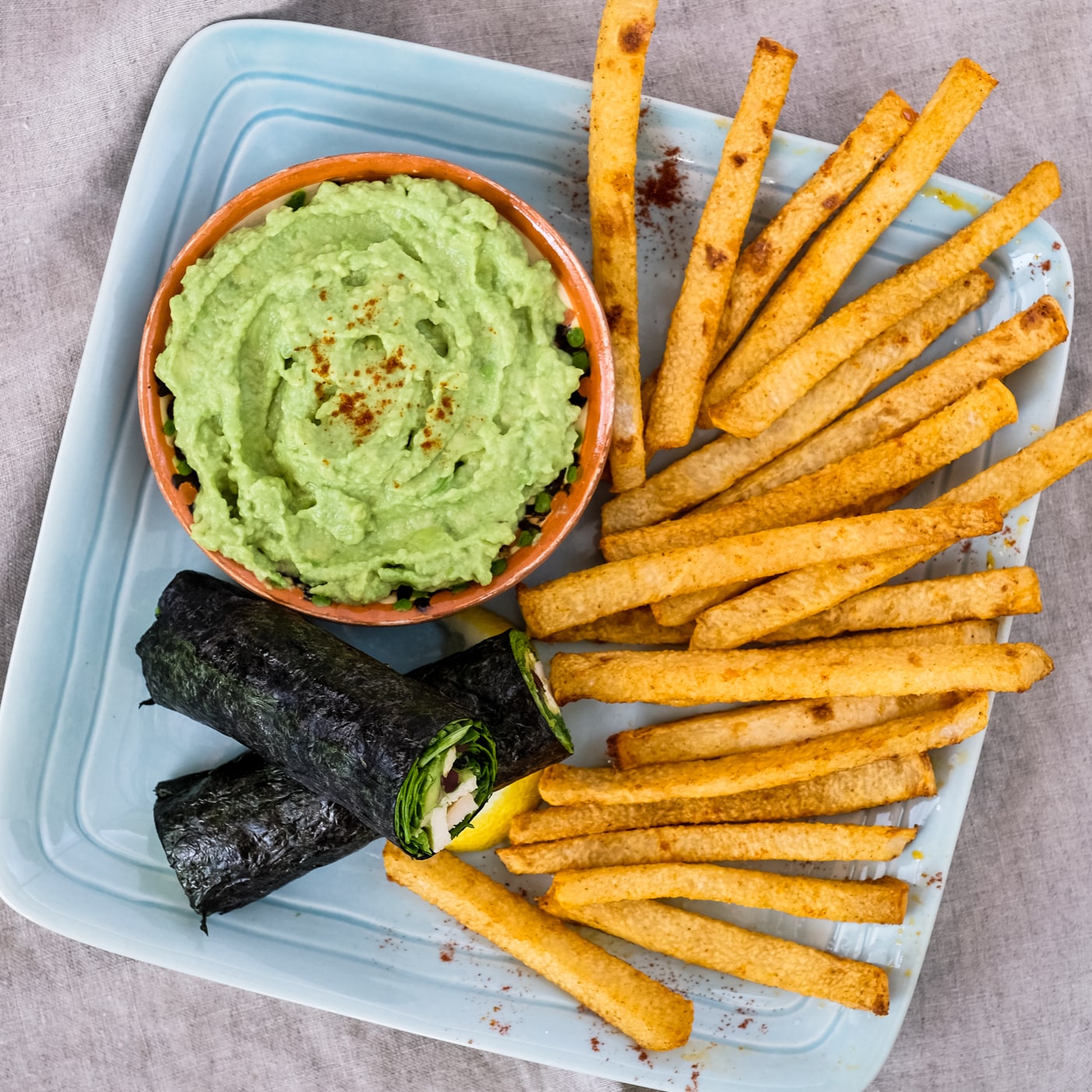 Chicken nori rolls served with an avocado dipping sauce and jicama fries