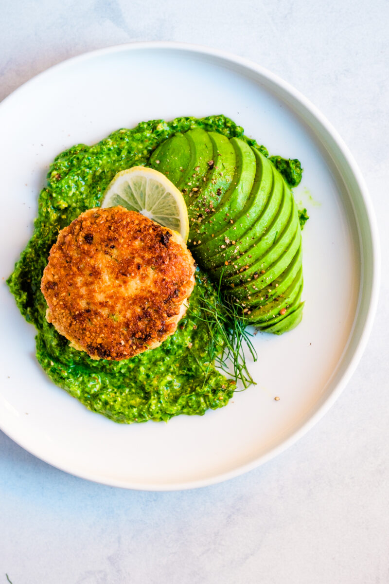 Alaskan salmon cakes with spinach pesto and avocado