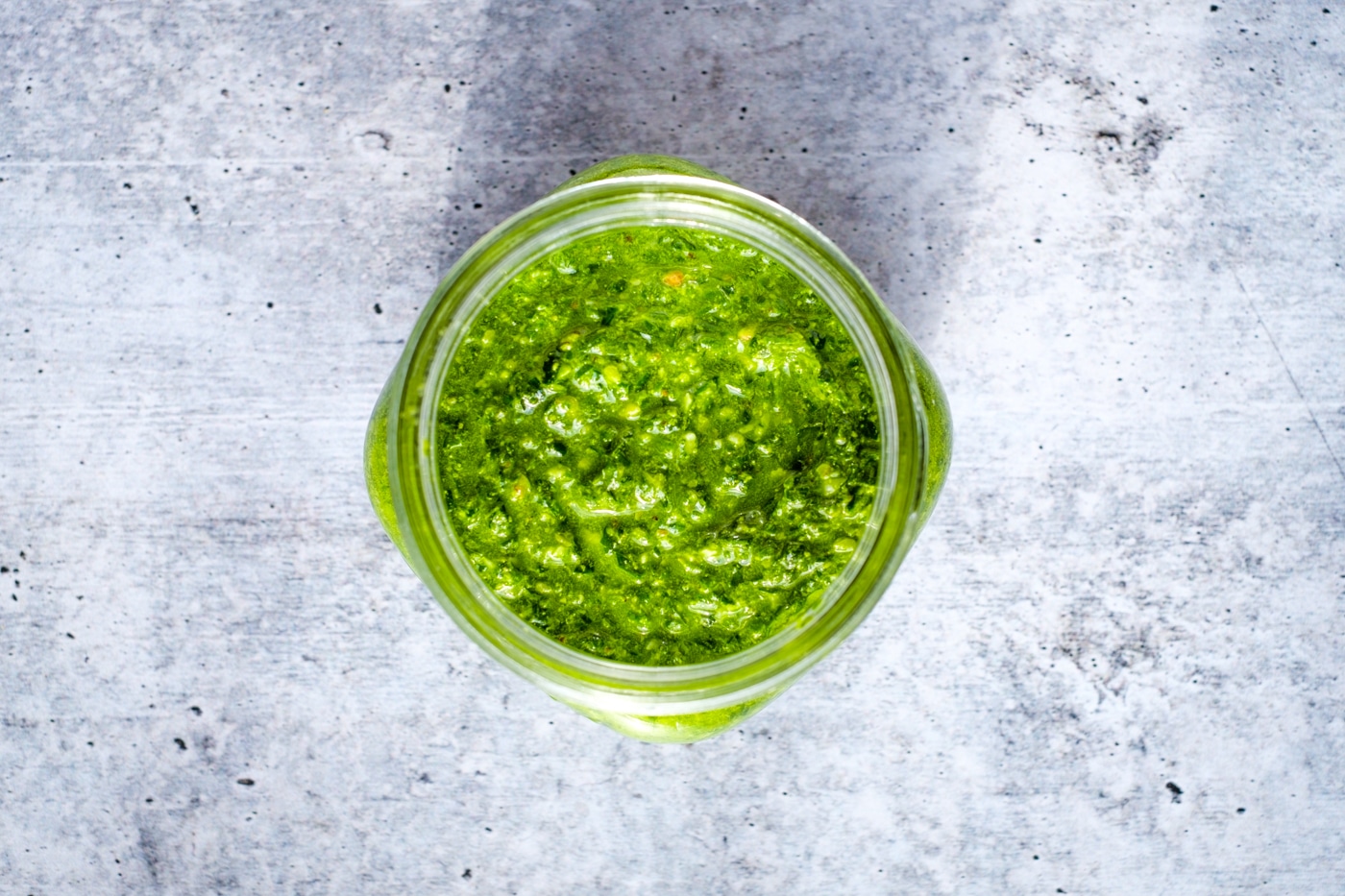 Spinach walnut pesto in a small jar