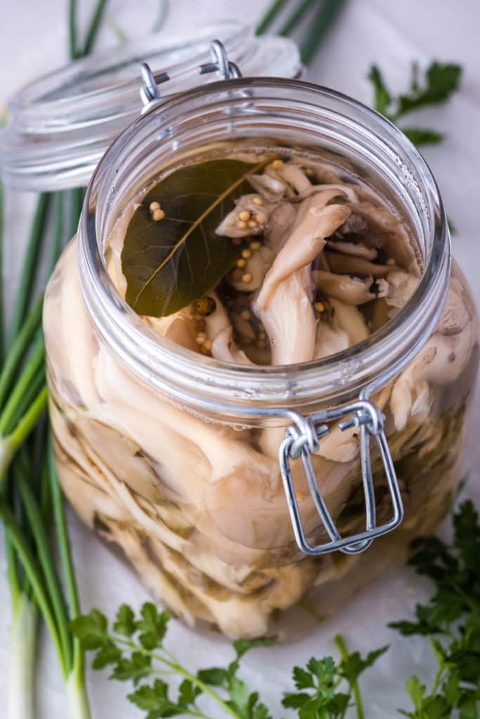 Marinated oyster mushrooms in a glass jar