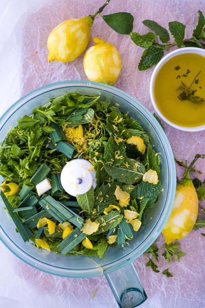 The ingredients for the gremolata sauce in a blender