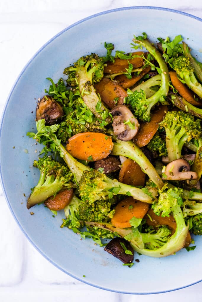 Broccoli and Mushroom Stir-Fry served on a plate. It looks beautiful and this is a quick and easy meal to put together.