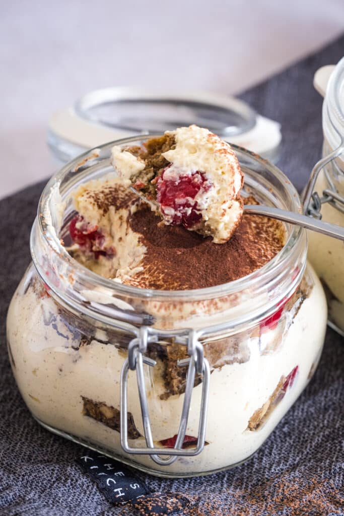 A spoon with gluten-free tiramisu