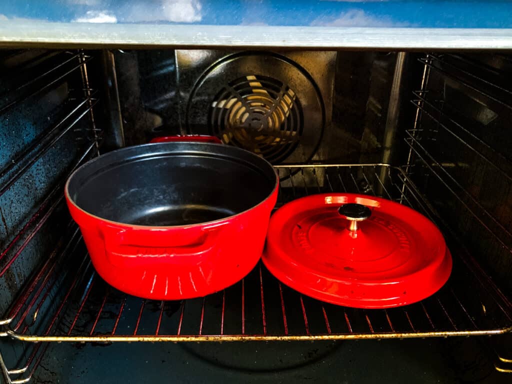 The empty cast iron pot in the oven. 