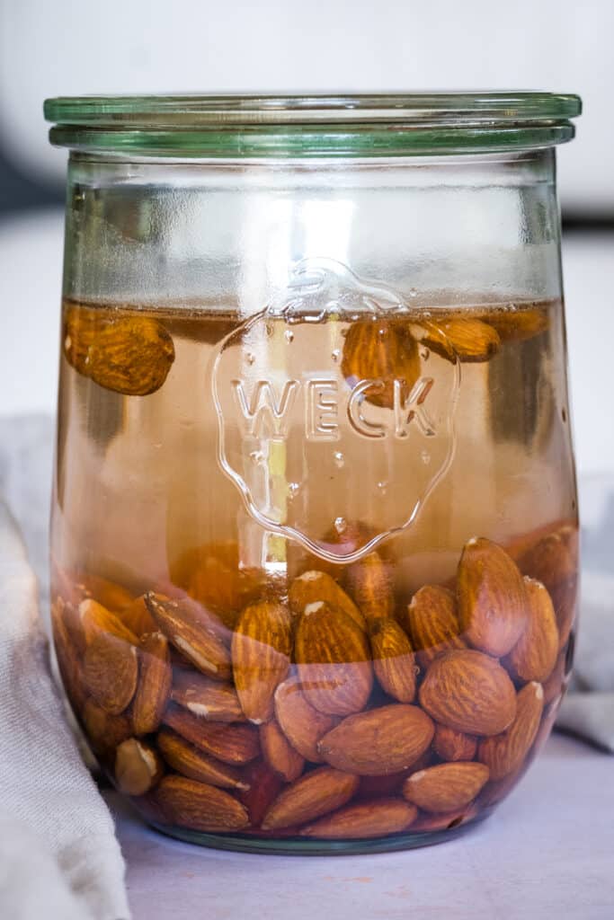 Soaked almonds in a glass jar