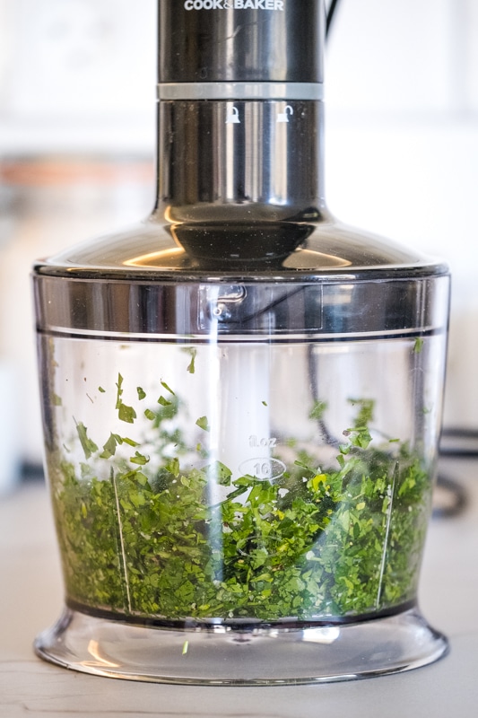 Chopping herbs in a food processor