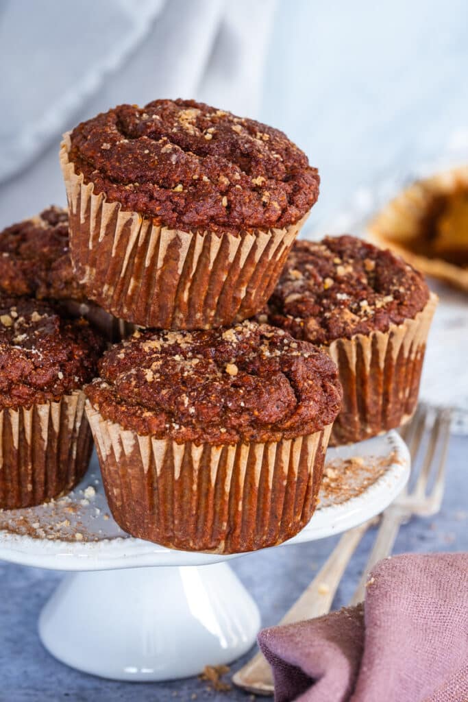 A cake stand with pumpkin muffins