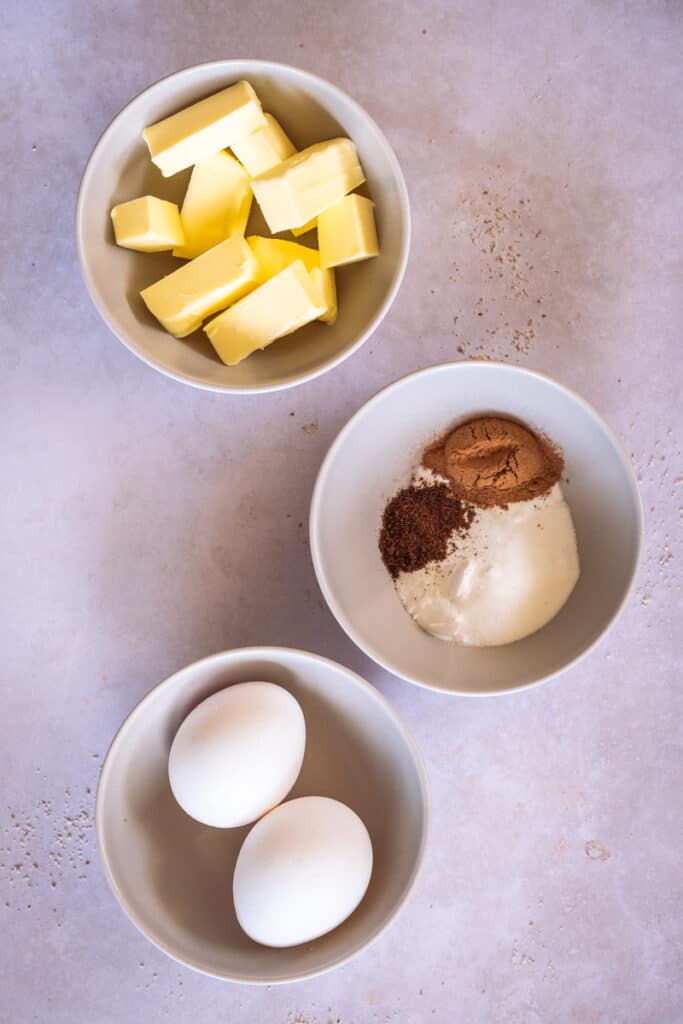 Small bowls with butter, eggs and spices