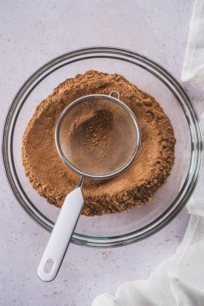 Sift the dry ingredients into a mixing bowl.