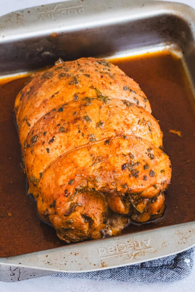 Roasting the turkey breast in a baking dish.