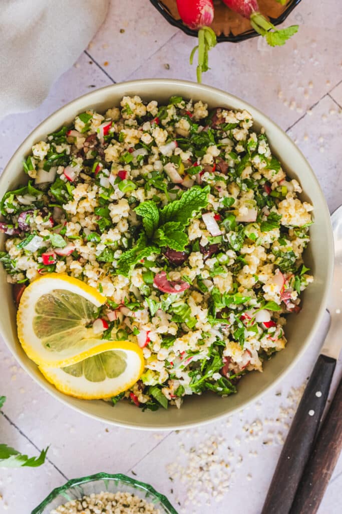 Gluten-free tabbouleh made with millet and hemp seeds, served in a bowl.