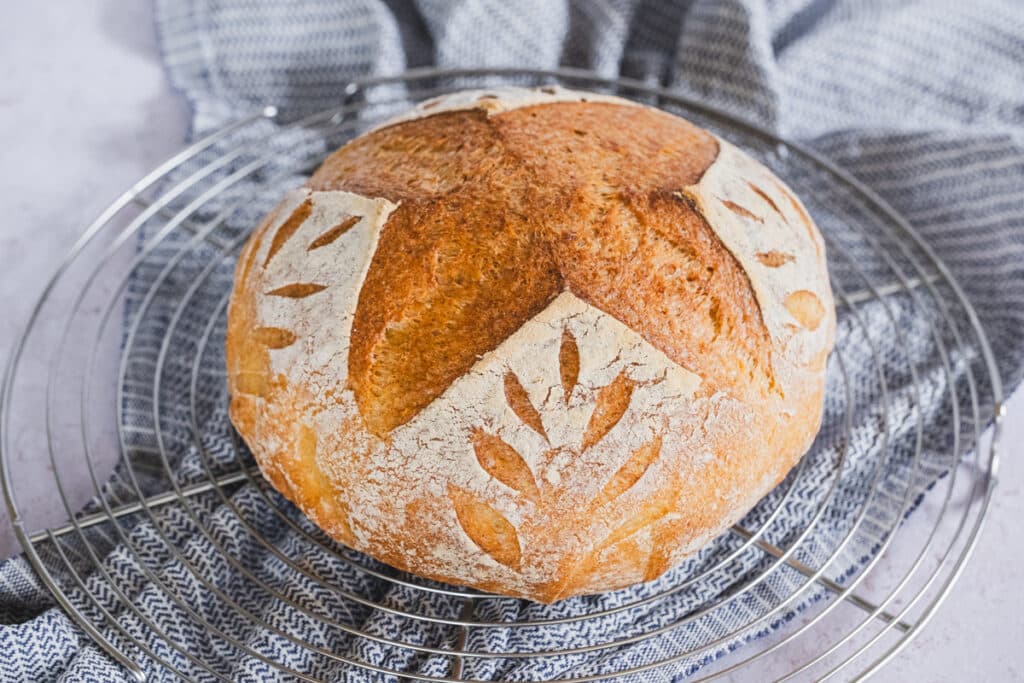The millet sourdough bread on a cooling rack