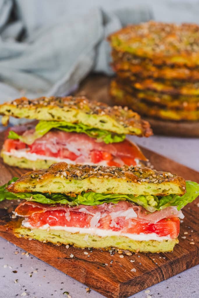 A sandwich made with avocado bread, sliced in half.