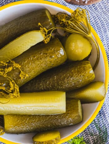 fermented dill pickles on a plate