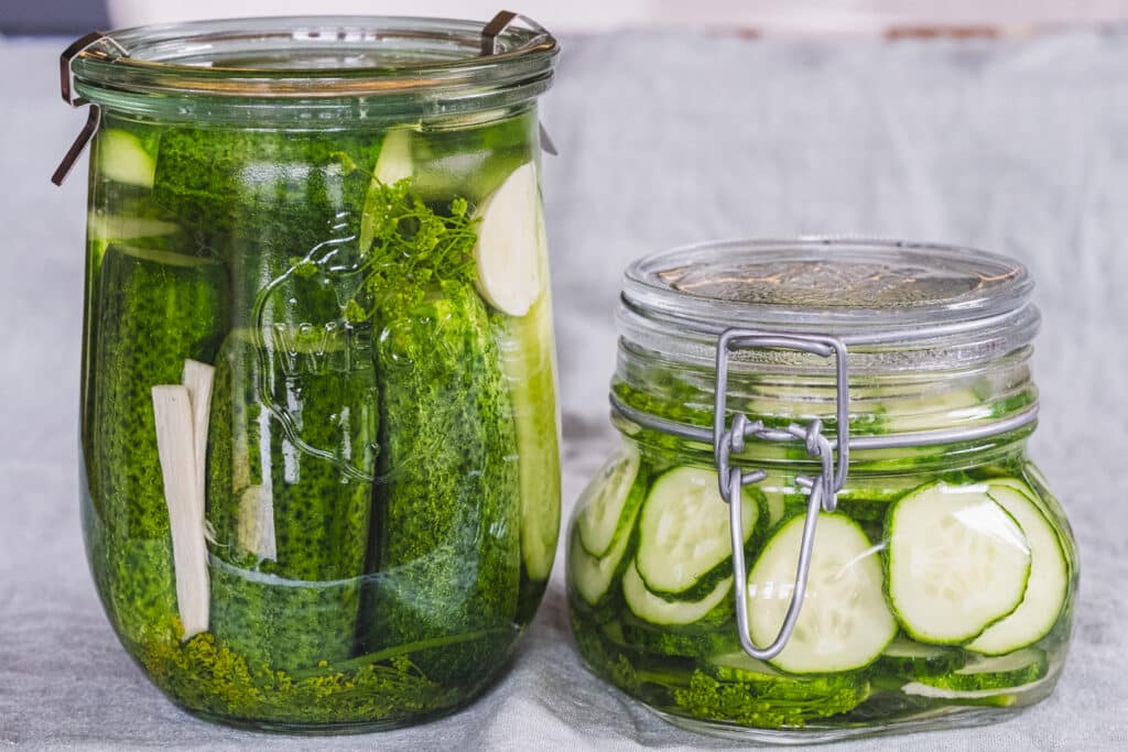 Two jars of fermented pickles.