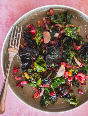 sauteed rainbow swiss chard on a serving plate and a fork