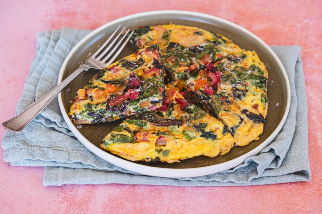 The frittata has been cut into four slices.