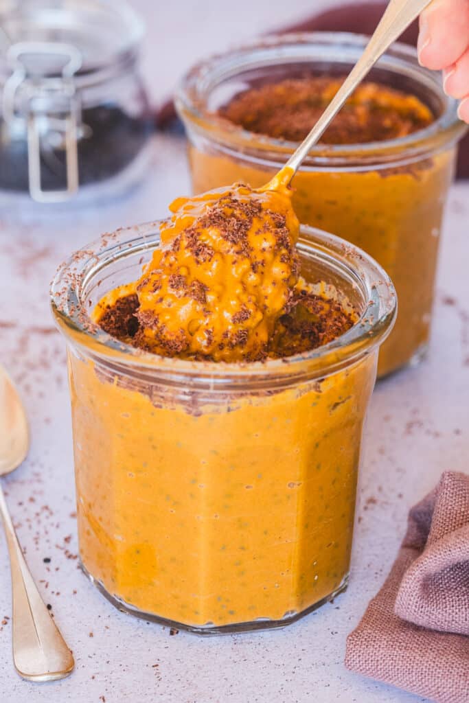 Two small jars with pumpkin spice basil seed pudding.