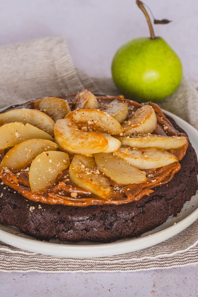 Whole Sweet Potato Chocolate Cake with Braised Pears on a serving plate