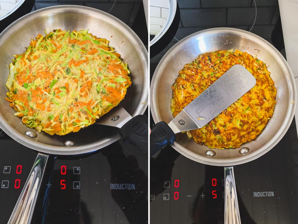 Carefully flipping the cooked pancake in the skillet.