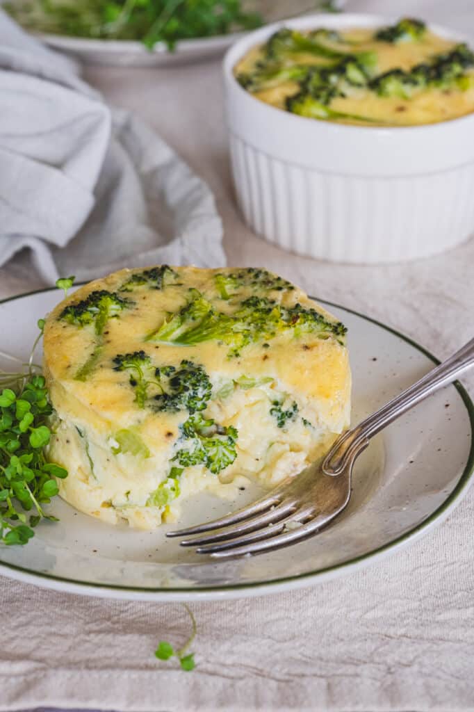 Broccoli flan with cottage cheese served on a plate.