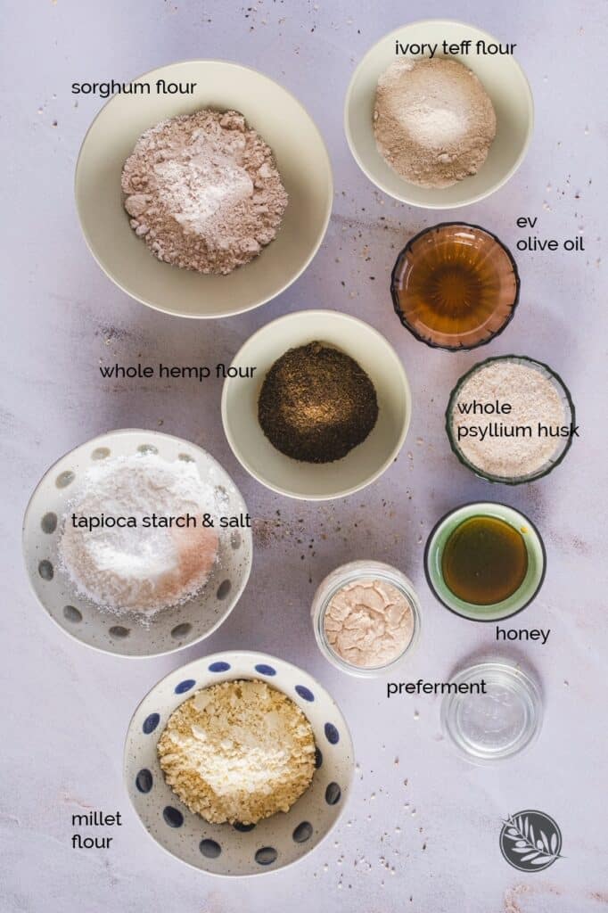 All the ingredients for the gluten-free sourdough baguette recipe are displayed together.