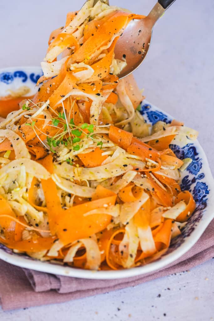 A plate of crunchy carrot and fennel salad.