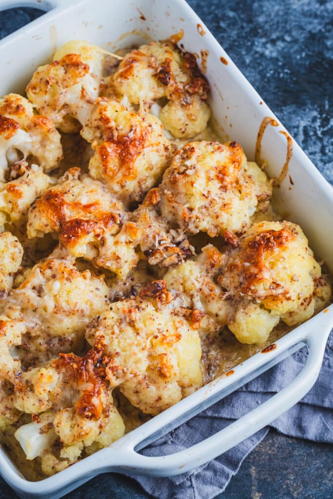 A white baking dish with cauliflower gratin.